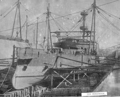 Starboard bow view of the USS Monadnock under construction in dry dock one at Mare Island Navy Yard in 1895.