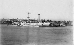 Boardside view of the USS Monadnock off Mare Island Navy Yard. Vallejo, California is in the background, circa 1896