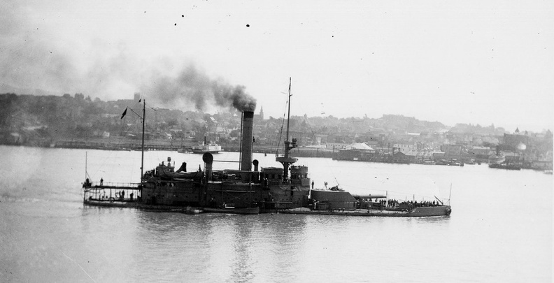 USS Wyoming (BM 10) is seen in the Mare Island channel in 1902. Vallejo, California is in the background. Wyoming was commissioned at Mare Island Navy Yard on 8 December 1902, and indication are that her forward turret was installed at the Navy Yard.