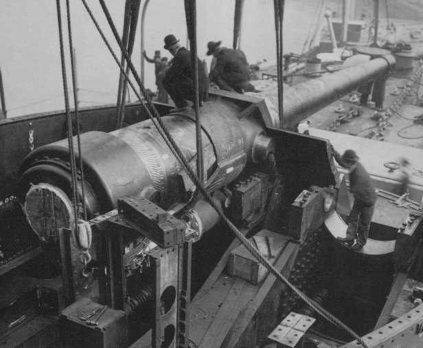 USS Connecticut BB-18 getting one of her bow 1245 (30.5 cm) guns installed